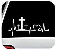 a sticker with the word faith and a cross on it, in white ink