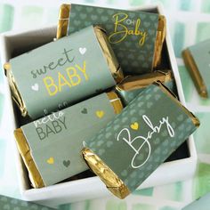 baby candy bars in a box with gold foil wrappers