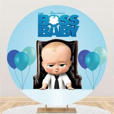 the boss baby character is sitting in a chair with balloons around him and looking at the camera