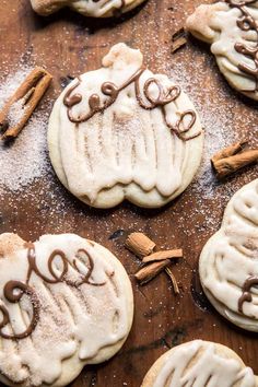 some cookies with cinnamon and icing on a table