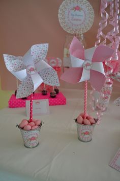 two baskets filled with eggs sitting on top of a table