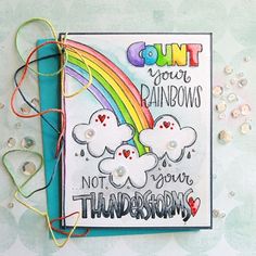 a handmade card with some thread and buttons on it, featuring the words count your rainbows not your thunderstorms