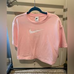 This Nike Cropped Tee Is Slightly Thicker Than A T-Shirt, But So Trendy And Cute. It’s Brand New With The Tag Still On. Size Medium! Nike Cotton Tops For Spring, Nike Trendy Top For Spring, Trendy Nike Short Sleeve Tops, Trendy Pink Nike Tops, Trendy Nike T-shirt For Spring, Trendy Nike Spring T-shirt, Nike Athleisure T-shirt For Spring, Nike Sporty Shirt For Spring, Nike Spring Athleisure T-shirt