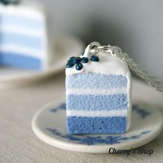 a piece of blue cake sitting on top of a plate