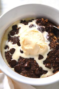 a bowl filled with ice cream and chocolate chips