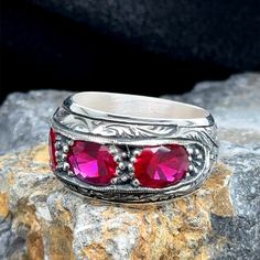 Men Handmade Ruby Stone Ring, Engraved Ruby Stone Band Ring, Handmade Natural Red Ruby Stone Ring, 925k Sterling Silver Ring Elevate your style with this handcrafted men's ring, showcasing the natural beauty of a vibrant ruby stone. Meticulously crafted by skilled artisans, this 925k sterling silver band features an exquisitely engraved ruby gemstone that adds a touch of sophistication to any outfit. The deep red hue of the ruby is captivating, making this ring a statement piece that commands attention. Whether you're dressing up for a special occasion or seeking a timeless accessory, this handmade ruby stone ring offers a perfect blend of elegance and craftsmanship. Embrace the allure of this one-of-a-kind creation and elevate your personal style. Ruby Stone Ring, Engraved Wedding Band, Emerald Stone Rings, Stone Wedding Ring, Mystic Topaz Ring, Ring Man, Handmade Silver Ring, Malachite Rings, Stone Wedding