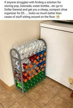 a rack full of water bottles next to a refrigerator