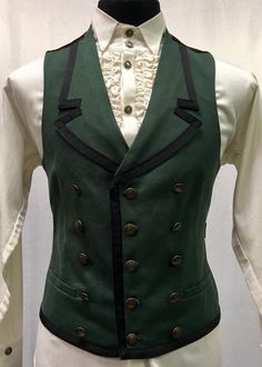 "A stylish men's vest with a military/nautical vibe. A vest made in green 100% cotton denim lined in sleek black satin and black satin in back. Fifteen vintage style brass liberty coin buttons adorn the front and the collar and bottom of the vest are lined with black ribbon trimming. Two working pockets are at either side in front. The vest can be tightened at the waist in back with satin strapping and a metal slider. Comes in sizes Small - 3X. Fabulous! Measurements: Small: Chest 40\" Stomach 3 Steampunk Sleeveless Vest With Buttons, Military Style Green Sleeveless Vest, Green Military Sleeveless Vest, Fitted Green Vest With Button Closure, Retro Cotton Vest With Buttons, Vintage Green Cotton Vest, Sleeveless Buttoned Vest For Costume, Retro Green Cotton Vest, Vest Outfits Men