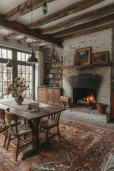 a dining room table with chairs and a fire place