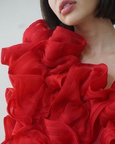 The Ellaella Pouf Dress is a stunning display of haute romance, made to order for special occasions and red-carpet affairs. This bold artful dress is entirely made by hand with couture sewing techniques, with each red silk organza hand-pleated bloom stitched, gathered, and sewn on by our skilled team in New York. 100% silk organza Upon placing your order, please e-mail us at info@jasminechong.com with order number and sizing information. Added customisation (lengthening, etc.) may incur addition Couture Ruffled Gown For Gala, Couture Gala Gown With Ruffles, Couture Evening Dress With Ruffles, Couture Organza Evening Dress For Gala, Red Luxury Gown For Gala, Red Organza Floor-length Dress, Red Floor-length Organza Dress, Couture Floor-length Ruffled Gown, Red Fitted Organza Gown