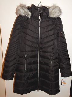 MICHAEL KORS Brand New With Tags Women's puffer jacket. Size: Small. Color: Black. Shell:100% polyester Lining:100% polyester Filling:55% down 45% waterfowl feathers KNEE LENGTH.SILVER TONE METAL HARDWARE.DETACHABLE HOODIE.FAUX FUR TRIM. FABULOUS JACKET !!!! WARM AND LIGHTWEIGHT !!!!! Puffer Jacket Women, Metal Hardware, Fur Trim, Puffer Jacket, Canada Goose Jackets, Vest Jacket, Hooded Jacket, Feathers, Faux Fur