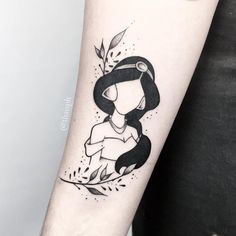 a woman's arm with a black and white tattoo design on the left forearm