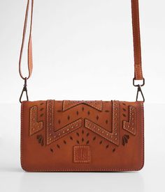 STS Evie Studded Crossbody Leather Purse - Brown , Women's Tan Embroidered leather purse Zipper closure Multiple interior compartments Removable shoulder strap Dimensions: 8(L) x 1 1/2(W) x 5(H). Due to the nature of leather/suede, small variances of color in the skin may occur, this is in no way considered a defect. These are inherent characteristics of leather/suede and will enhance the individual look of your garment.. Outer: 100% Leather. Inner: Cotton/Polyester. Do not wash. Do not bleach. Leather Crossbody Wallet With Snap Closure, Hand Tooled Travel Clutch, Purse For Women, Embroidered Leather, Leather Purse, Women's Bags, No Way, Leather Purses, Apparel Accessories