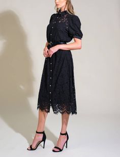 Elevate your wardrobe with this stunning black lace dress, blending affordable luxury with timeless sophistication. Created from a refined woven lace fabric, this piece features a classic shirt collar and a button-down front, offering a touch of tailored elegance. The short puff sleeves add a delicate, feminine flair, while the contrasting belt cinches the waist for a flattering silhouette. Western Gothic, Lace Shirt Dress, Lace Black Dress, Grace And Lace, Pajama Outfits, Short Puff Sleeve, Jumpsuits And Romper, Swimsuit Dress, Lace Dress Black