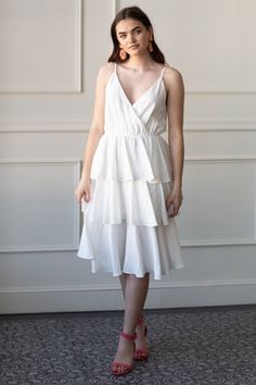 Clean and classic in our Martha ruffle midi dress. Ideal for a classic bride’s bridal shower dress or polished rehearsal dinner look. Adjustable spaghetti straps. Stretchy waist. Swishy tiered midi skirt. Available in white, black and red stripe. Martha White, Rehearsal Dinner Looks, Tiered Midi Skirt, Rehearsal Dinner Dresses, Ruffle Midi Dress, Midi Ruffle Dress, Classic Brides, Bridal Shower Dress, Shower Dresses