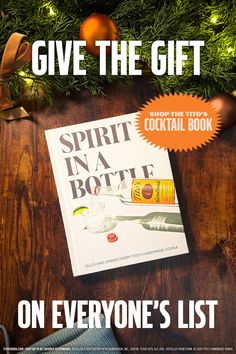 a book on everyone's list with christmas decorations around it and the title give the gift spirit in a bottle