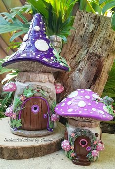 two small fairy houses sitting on top of a tree stump