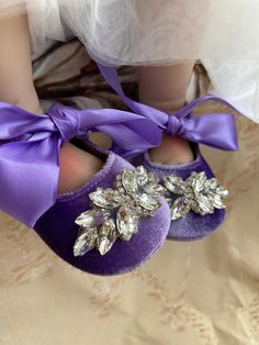 the bride's purple shoes are adorned with crystal jewels