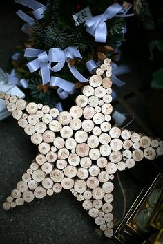 a wooden star ornament made out of wine corks