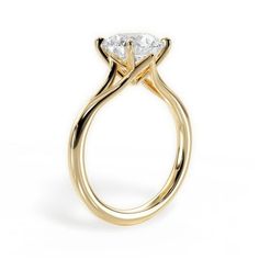 a yellow gold engagement ring with a pear shaped diamond in the center, on a white background