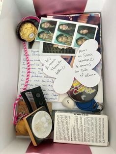 a box filled with lots of different items and writing on top of eachother