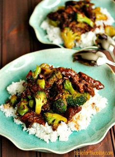 two plates with meat and broccoli on top of rice