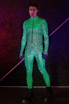 A hypnotizing, glow-in-the-dark odyssey of shapes and color. The Rapture Costume is a rave must-have. FEATURES: >Flattering Form-Fitting Construction >Luxurious & Silky, Non–Transparent Lycra Fabric >Robust & Front Zipper Closure >UV Reactive Fabric >Flawless Graphics On Both Front And Back >Saturated Colors True To The Pictures Oc Outfits, The Rapture, Body Suit Outfits, Lycra Fabric, Uv Reactive, Saturated Color, Mens Costumes, Body Suit, Festival Outfits