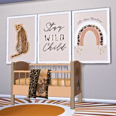 a baby's room with three pictures on the wall