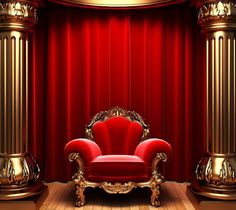 a red chair sitting in front of a red curtain with gold trimmings on it