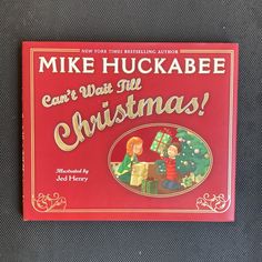 a book with an image of two children opening presents in front of a christmas tree and the title mike huckabee can't wait for christmas