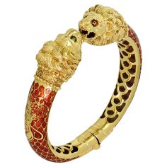 This gorgeous vintage bracelet features a double-headed chimera design intricately crafted in 18k yellow gold and red enamel and accented with gorgeous gold leaping lions on both sides of the bangle. Makers Mark A.5F. Made in Greece circa 1980s. Measurements: 0.70" (18mm) width, 7" (17.7cm) length. Designer Enamel Bangle Jewelry, Luxury Gold Plated Bracelets For Ceremonial Occasions, Luxury Yellow Gold Enamel Bangle, Luxury Gold Bangle Collectible, Luxury Collectible Yellow Gold Bangle, Luxury Red Gold Bracelet For Formal Events, Luxury Red Gold Bracelet For Formal Occasions, Luxury Yellow Gold Collectible Bangle, Luxury Gold Enamel Bracelets