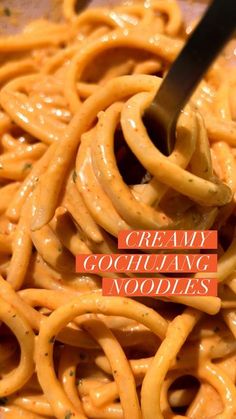 a fork is stuck into some noodles with the words, creamy gourmet noodles