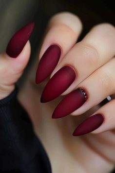 Deep oxblood red nails with a matte finish exude elegance and sophistication. These fall nails are perfect for a bold and classy look this season. Find more fall nail ideas and fall nail colors at nailhow.com. 🍷✨ Nails Design Fall, Thanksgiving Nails Design Fall, Fall Thanksgiving Nails, Dark Red Nails, Thanksgiving Nail Designs, Thanksgiving Nail Art, Thanksgiving Nail, Fall Gel Nails