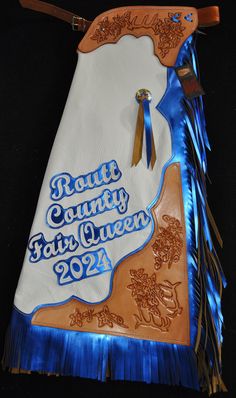 a white and blue bag with the words route county fair queen on it's side