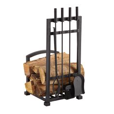 a firewood rack with logs and tongs