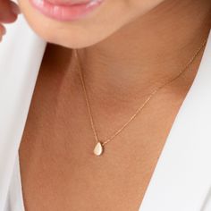 Gold teardrop necklace is a minimalist design crafted in 14k solid gold and is perfect for everyday wear. Its understated charm and high quality craftsmanship ensure it will be a beloved part of your jewelry collection for years to come. NECKLACE DETAILS * Material:14 carat solid gold * Weight: 1.38 grams (with 16 inch chain) * Dimensions: 6mm x 9mm * Chain: Cable * Style: Minimalist * Free Express Shipping Worldwide * 100% Handmade * Gift wrapping * Yellow and rose gold options are available * Minimalist 14k Gold Teardrop Pendant Necklace, Minimalist 14k Gold Drop Necklace With Delicate Chain, Minimalist 14k Gold Drop Necklace As Gift, Minimalist 14k Gold Drop Necklace For Gift, Minimalist 14k Gold Drop Necklace Gift, Dainty Teardrop Yellow Gold Charm Necklace, Minimalist Yellow Gold Teardrop Pendant Charm Necklace, Minimalist Pear-shaped Drop Necklace, Minimalist Yellow Gold Drop Necklace As Gift