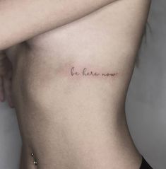 a woman's stomach with the words be kinder now tattooed on her side