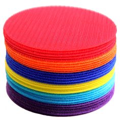 a stack of multicolored round coasters sitting on top of each other