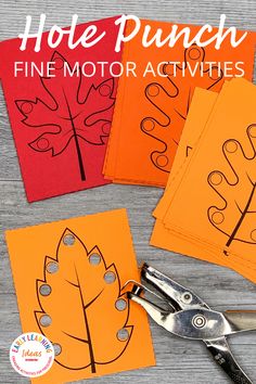 four leaf cut out cards with scissors on the table