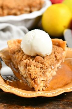 a slice of apple pie on a plate with ice cream and apples in the background