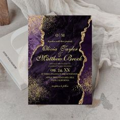 an elegant purple and gold wedding card