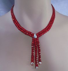 This necklace comfortable against the skin, it is not stiff or scratchy. It closes in the back with velcro. The stones are not secured with any metal fittings so this will not snag your costume or your partners. The clear design will match any dress that you own because it has flesh tone background the only thing visible are the crystals. Luxury Red Beaded Pendant Necklace, Ballroom Necklace, Ballroom Jewelry, Jewelry Necklace Simple, Nice Jewelry, Dance Jewelry, Necklace Swarovski, Basic Jewelry, Necklace Patterns