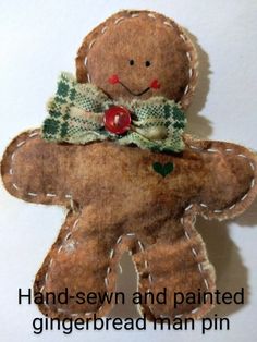 a gingerbread man pin with the words hand - sewn and painted gingerbread man pins