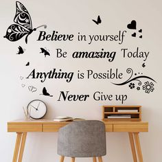 a desk with a chair and wall sticker on it that says, believe in yourself be amazing today anything is possible never give up