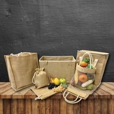 an advertisement for a grocery store with bags and fruits on the counter top, in front of a chalkboard background