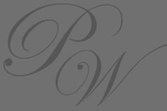 the word w is written in cursive writing with black ink on a gray background