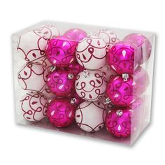 pink and white ornaments in a clear box