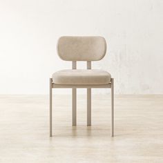 a white chair sitting on top of a hard wood floor