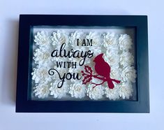 a shadow frame with flowers and a bird on it that says i am always with you