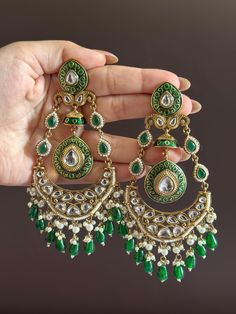 Statement earrings for a statement look! These handmade high quality kundan polki and meenakari earrings in stunning green  and gold are a unique addition to your outfit to glam it up! These can be paired with both Indian and western outfits. They are also extremely lightweight because they are handcrafted. Easy on your ears and beautiful for the eyes 💖 For any queries, please reach out to us. Happy shopping! Green Indian Earrings, Long Earrings Indian, Diwali Jewellery, Meenakari Earrings, Indian Earrings, Green Earrings, Pakistani Wedding, Western Outfits, Long Earrings